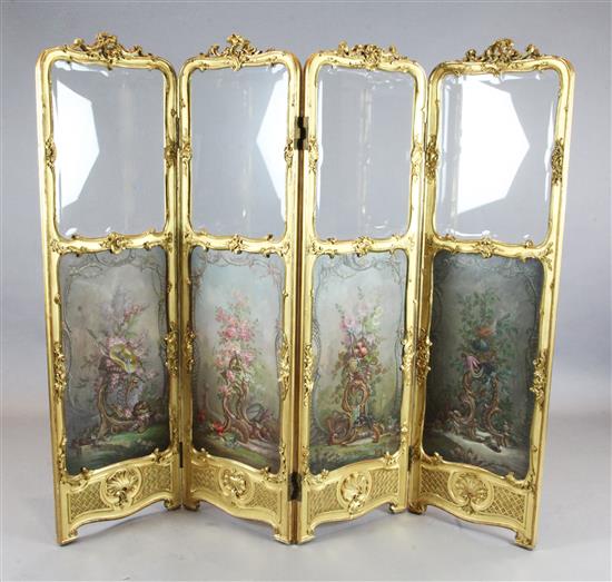 A Louis XV style giltwood and gesso four fold screen, Width of each panel 1ft 6in. H.5ft